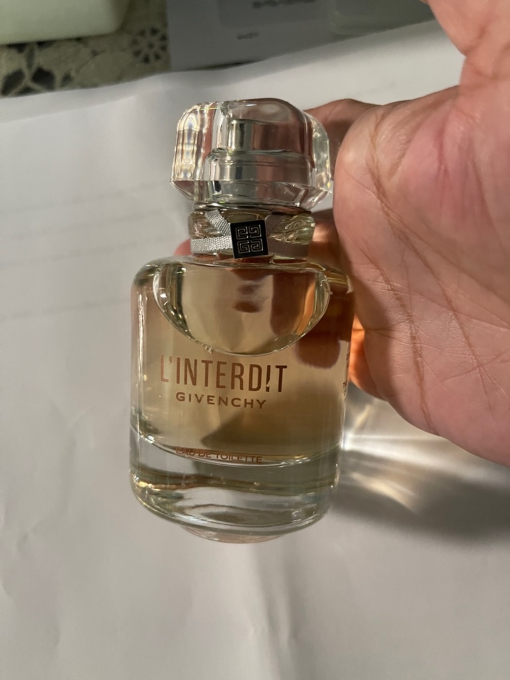 Givenchy L'Interdit Bottle in Clear Glass with Light Amber Liquid